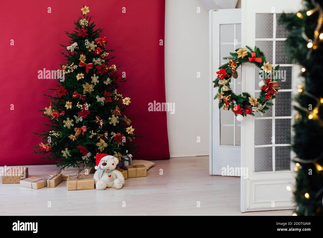 christmas tree with colorful balls and gift boxes over white wall Stock ...