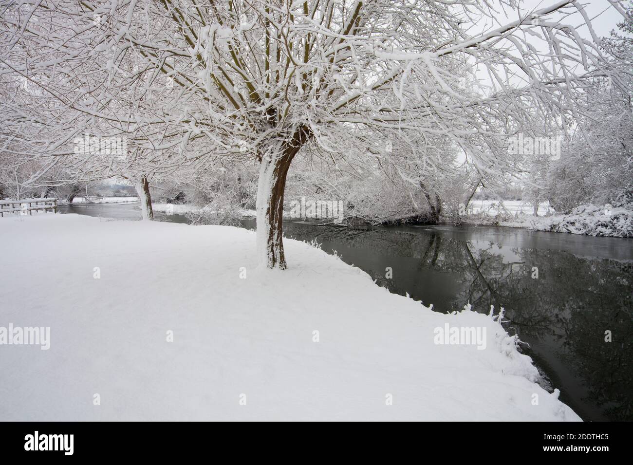 New snow on the water meadows along the River Stour at Flatford in Suffolk Stock Photo