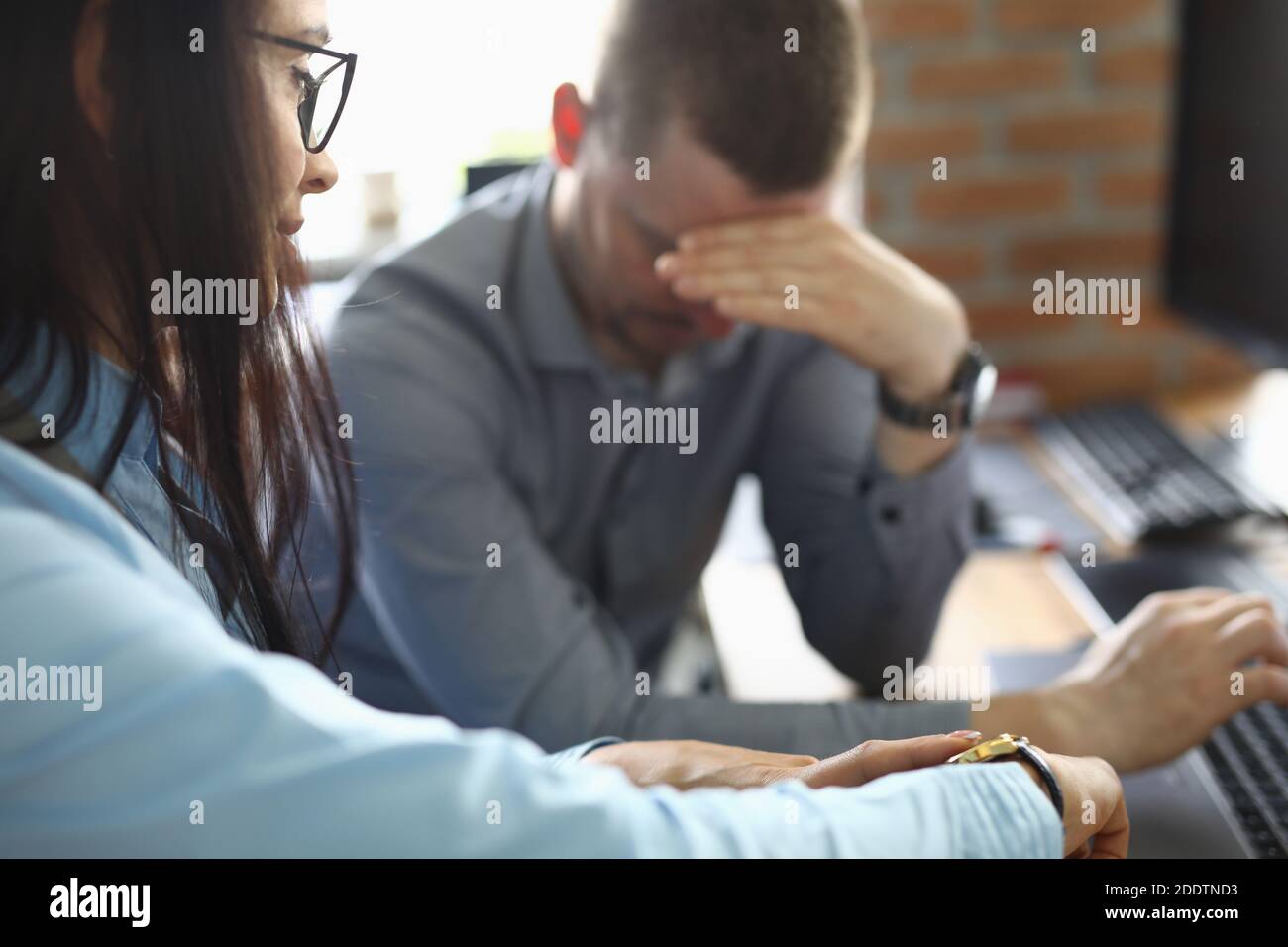 Man regret that he make mistake and sit sad with his head down. Stock Photo