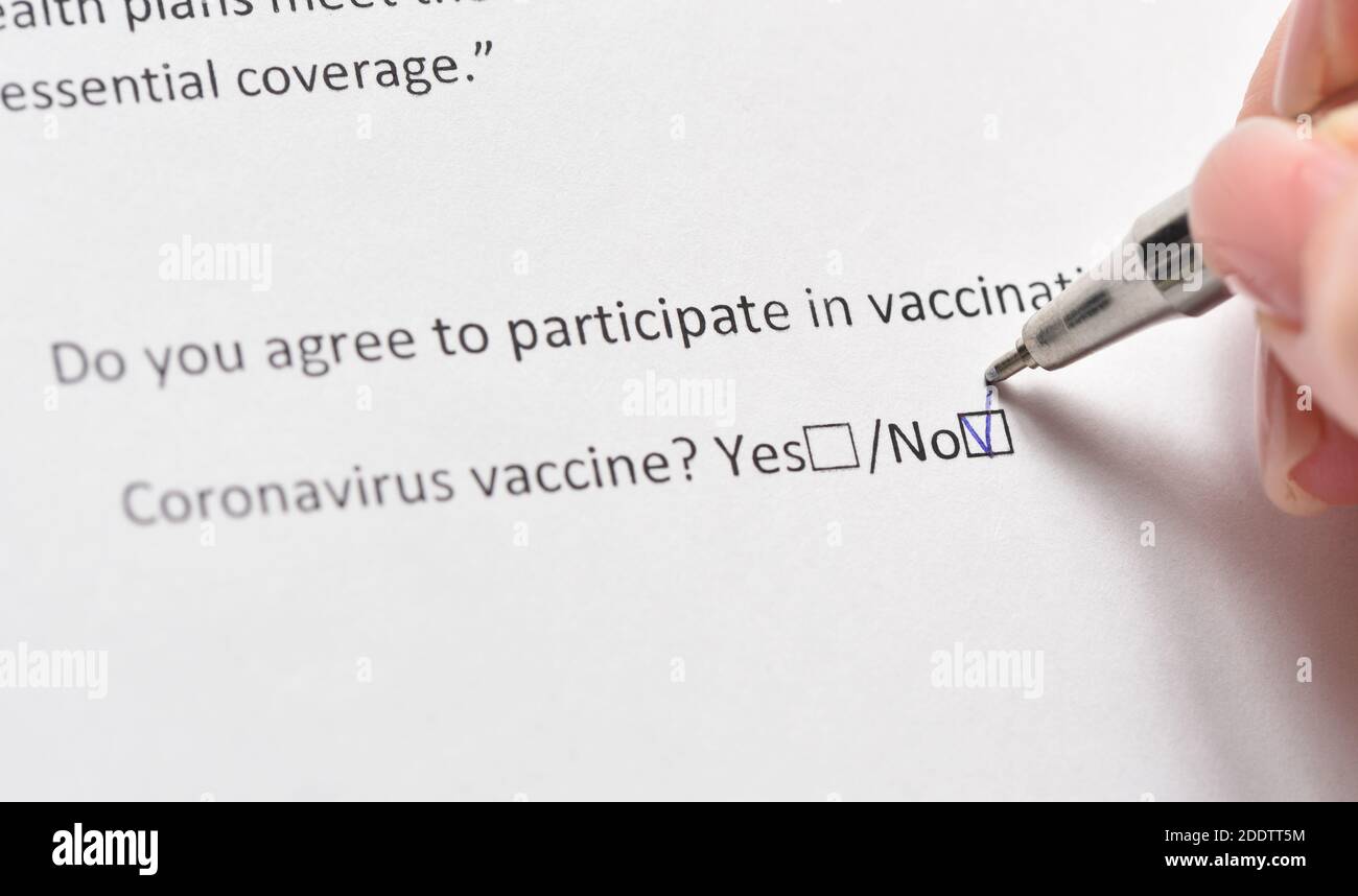 Refusal of vaccination against coronavirus signs a person, fearing side effects Stock Photo