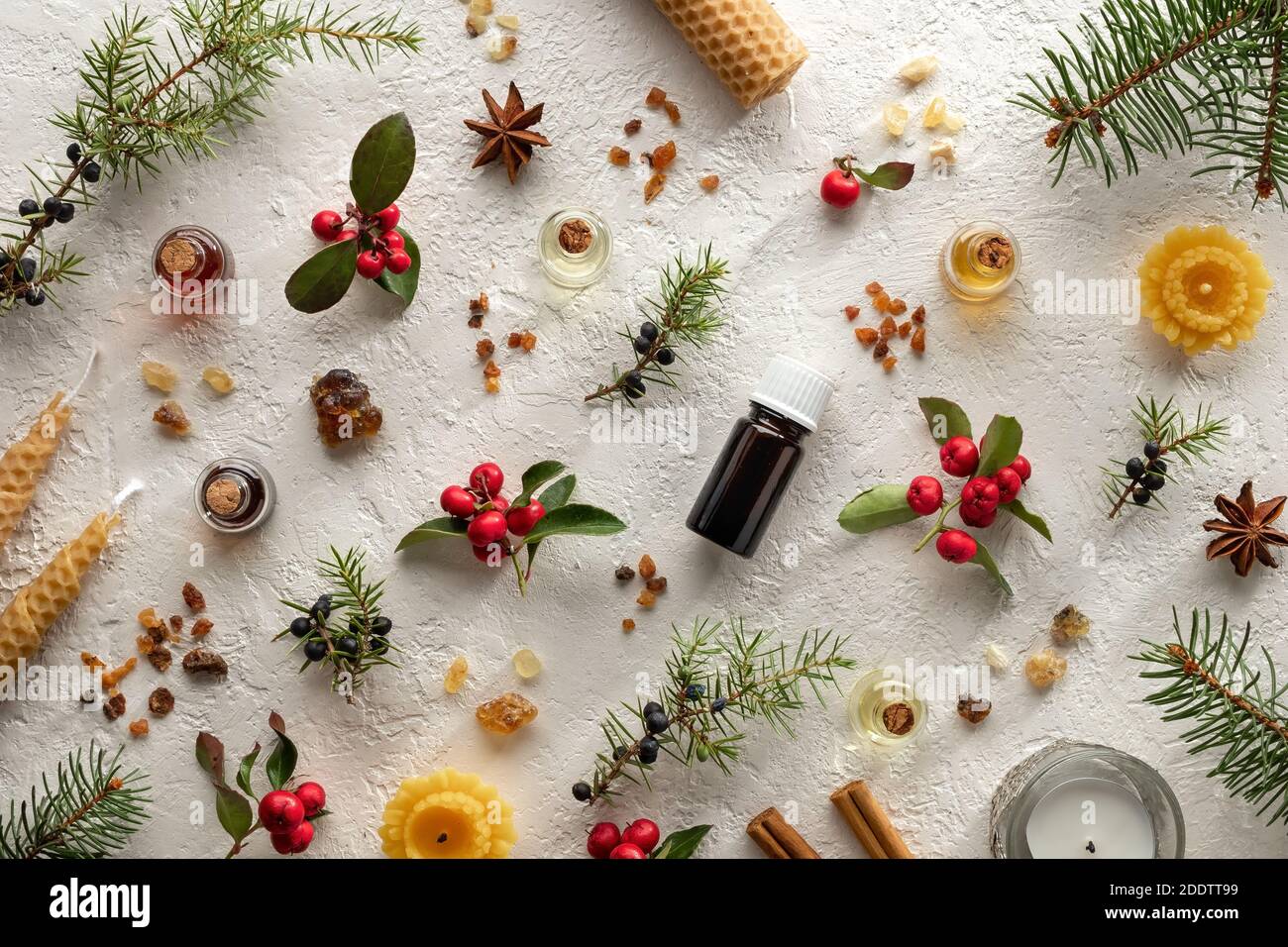 Christmas selection of essential oils with frankincense, myrrh, wintergreen, juniper and other herbs Stock Photo
