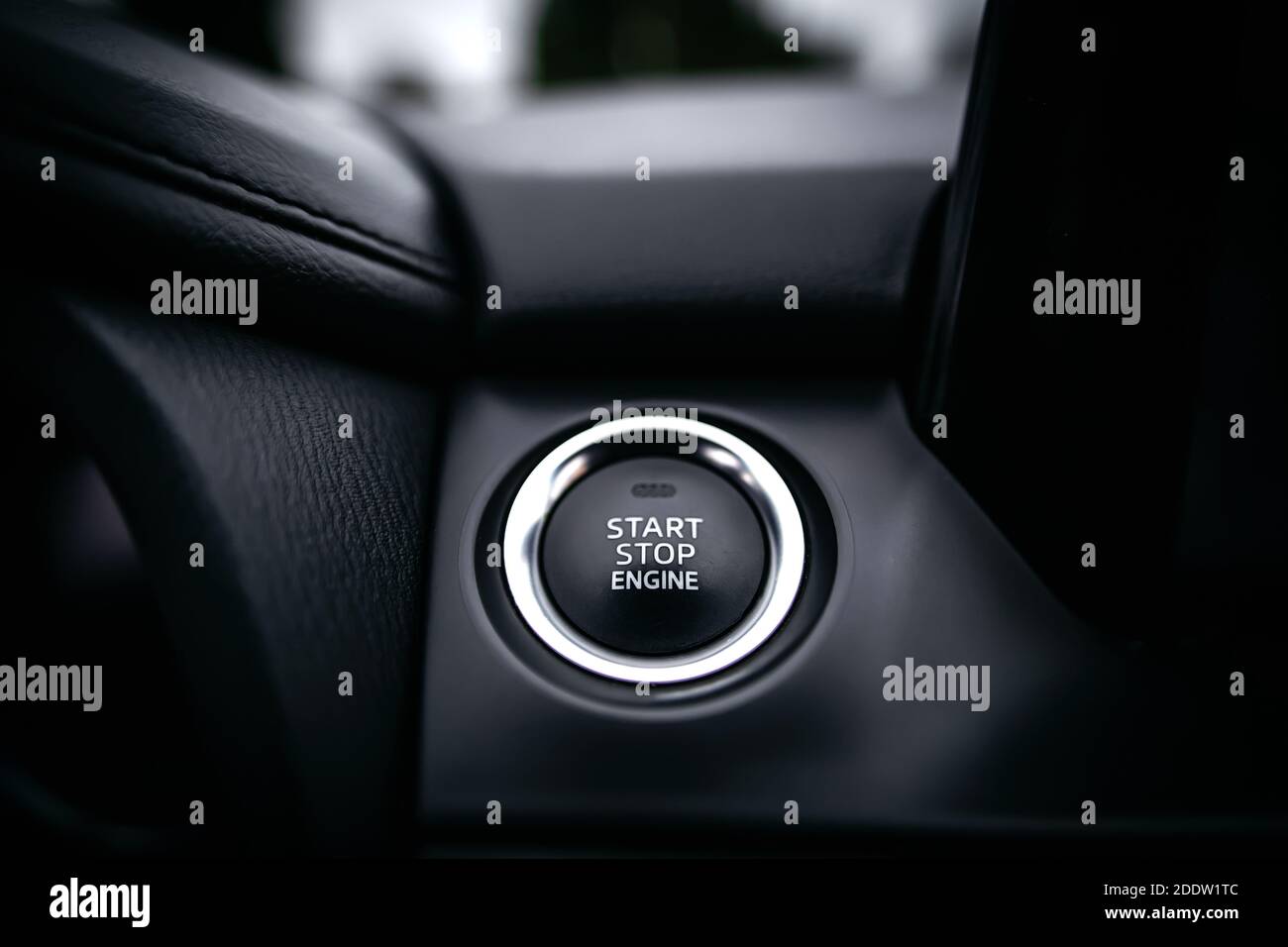 Close up Engine start stop button from a modern sport car black luxury interior Stock Photo