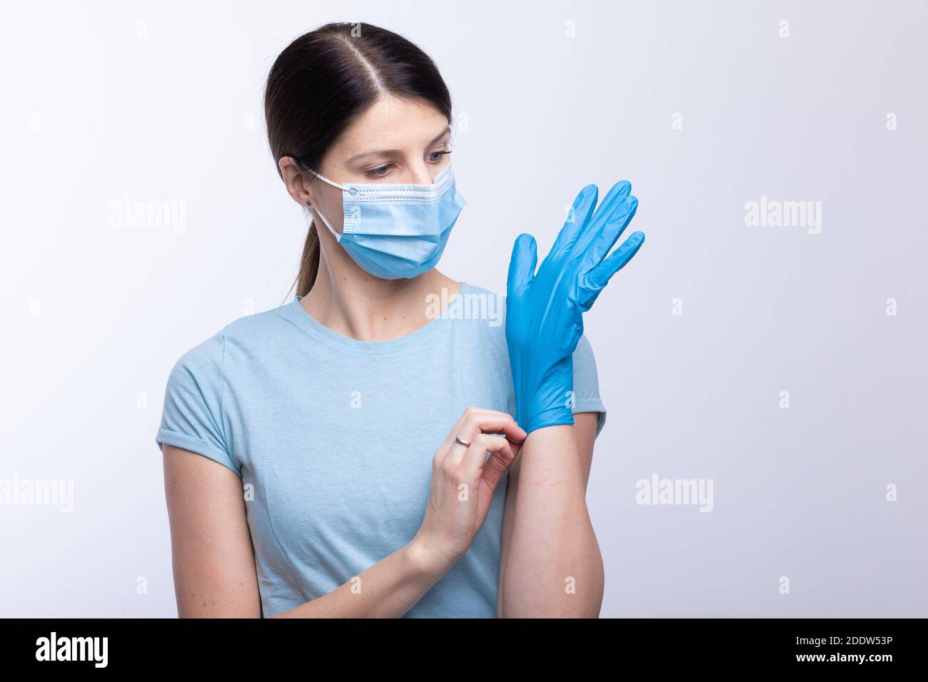 Nurse or doctor profesional uniform with face mask wear and checking protective gloves stock photo Stock Photo
