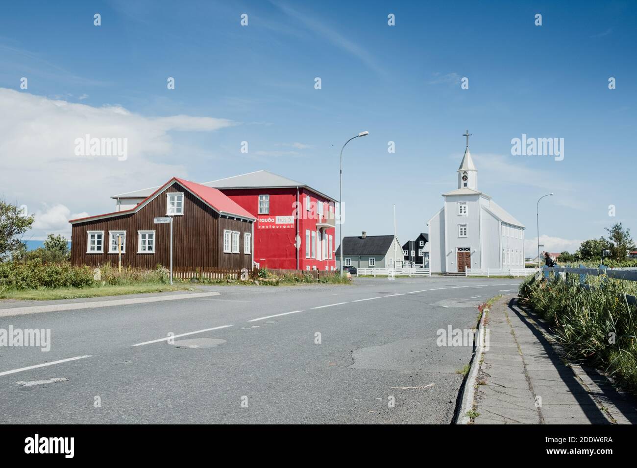 Street view of Eyrarbakki in South Iceland, view of the church and colourful houses Stock Photo