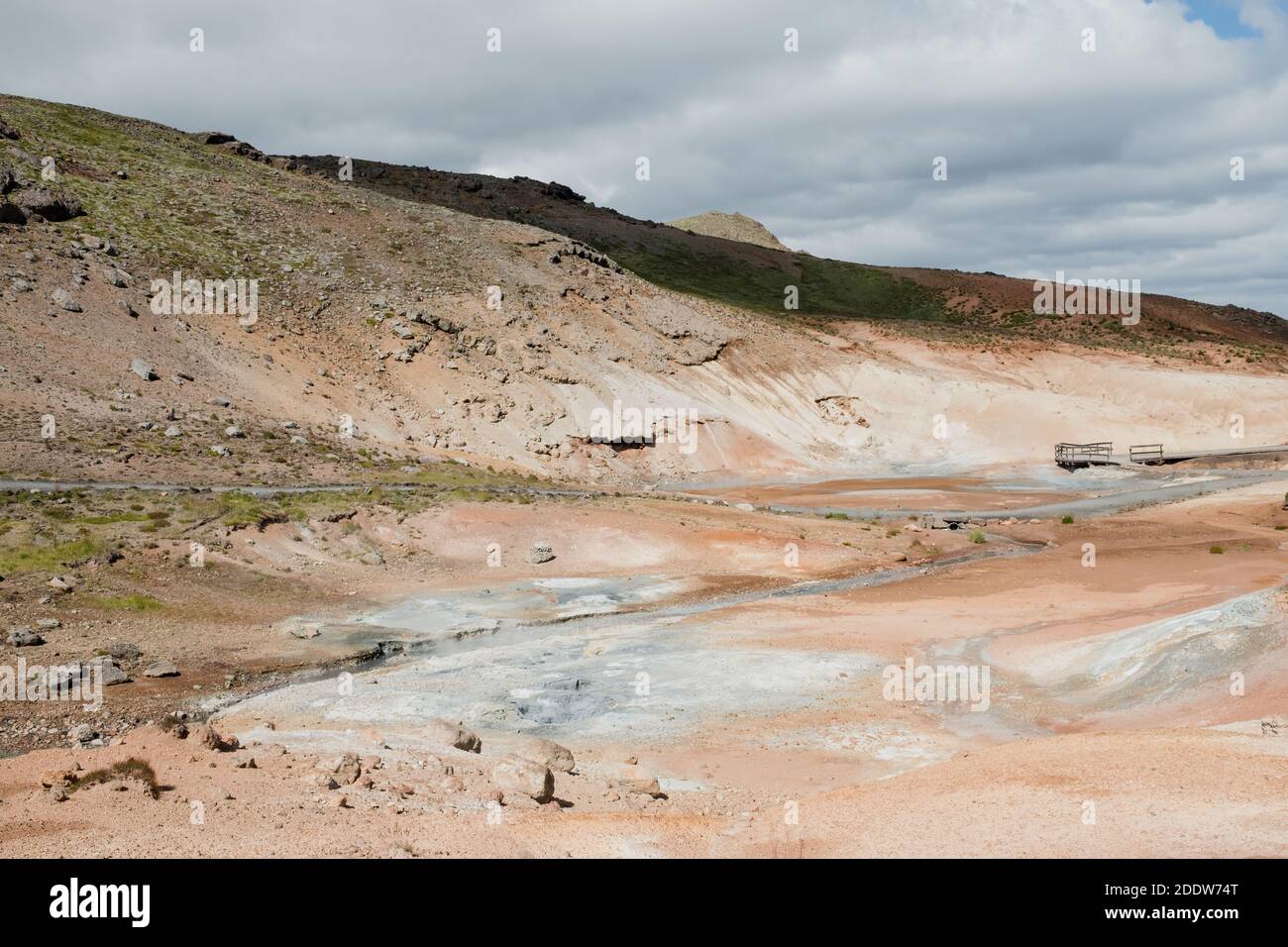 Krýsuvík is a geothermal area with steaming mud pools, streams and hot springs in the south west of Iceland. It is also a popular tourist attraction. Stock Photo