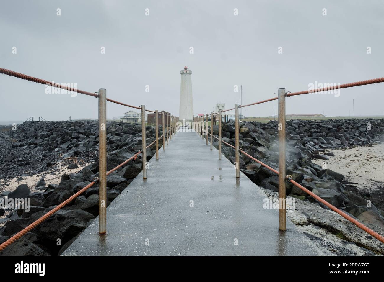 View of the new Garður Lighthouse on the Reykjanes Peninsula, Iceland taken from the old lighthouse on a stormy day. Stock Photo