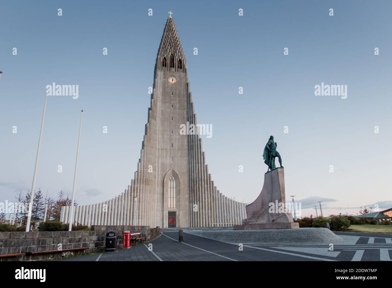 The famous church and tourist attraction Hallgrímskirkja located in downtown Reykjavík, taken at dusk with a clear blue evening sky and lights. Stock Photo
