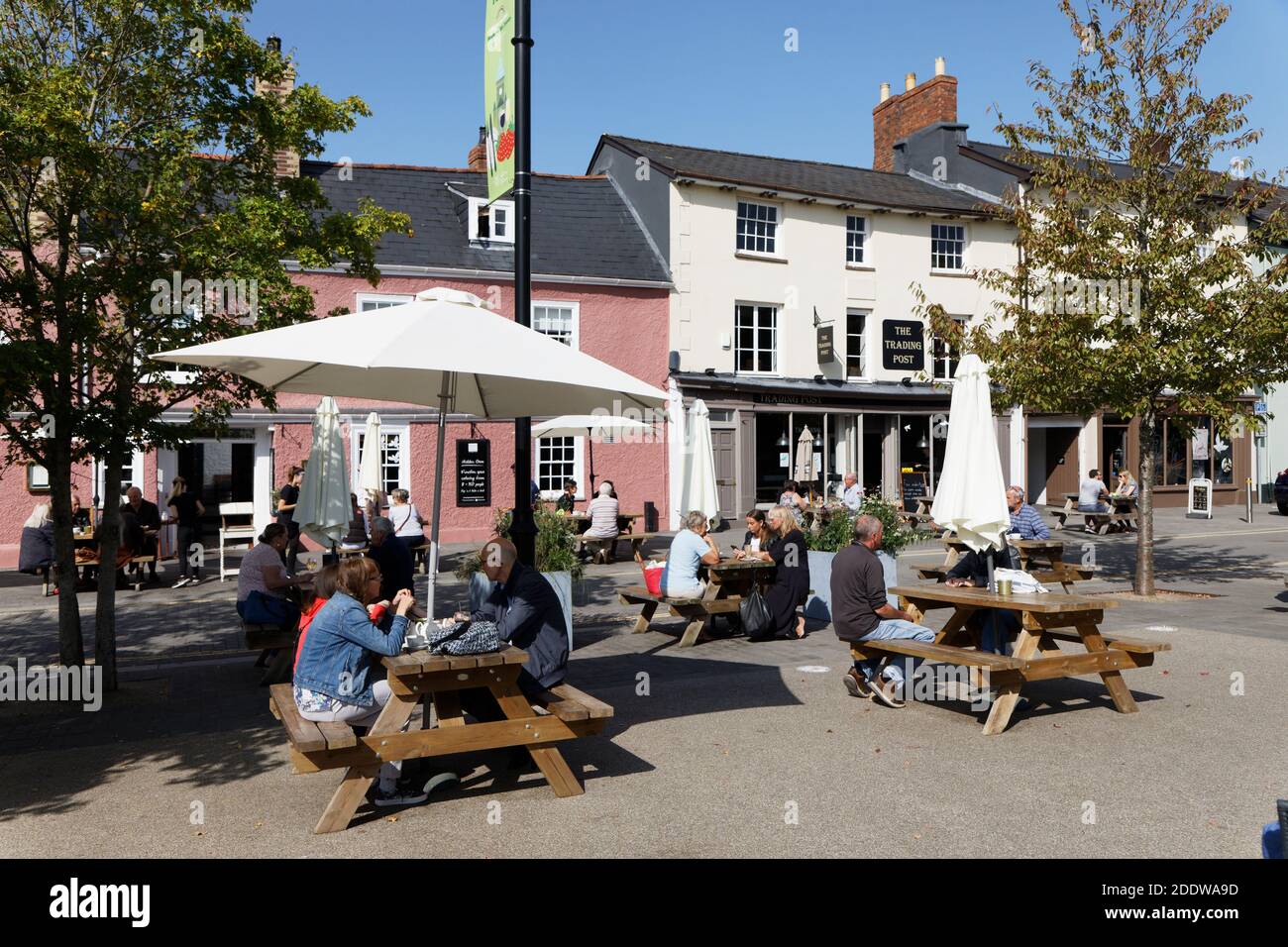 People sitting at tables at public house outdoors during pandemic, Abergavenny, Wales, UK Stock Photo