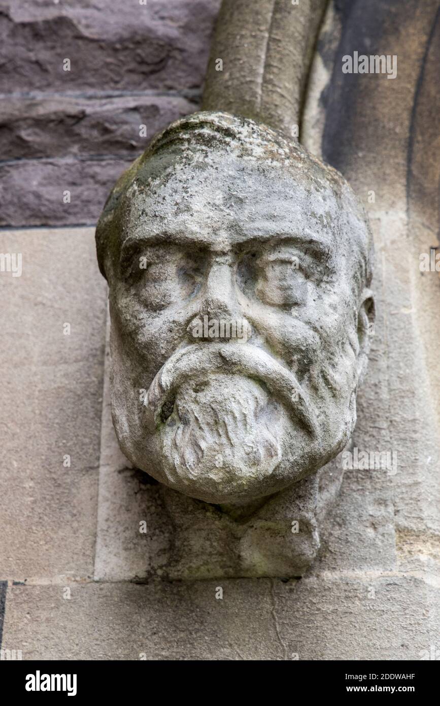 Carved stop head of Andrew Carnegie, on left of entrance to the