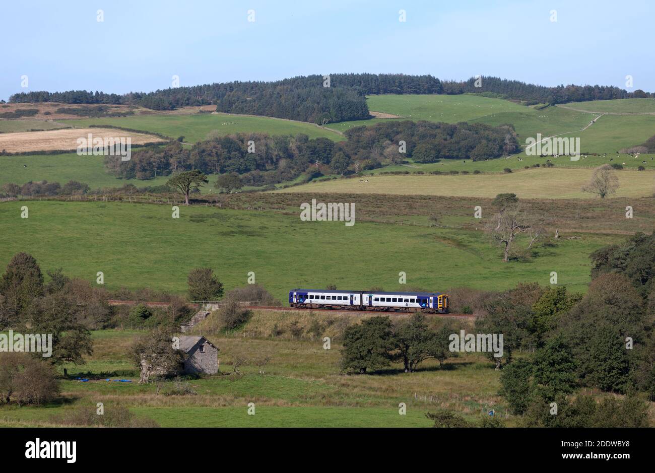 Northern Rail class 158 diesel train on the rural 'little north western' railway passing the north Lancashire countryside at Arkholme Stock Photo