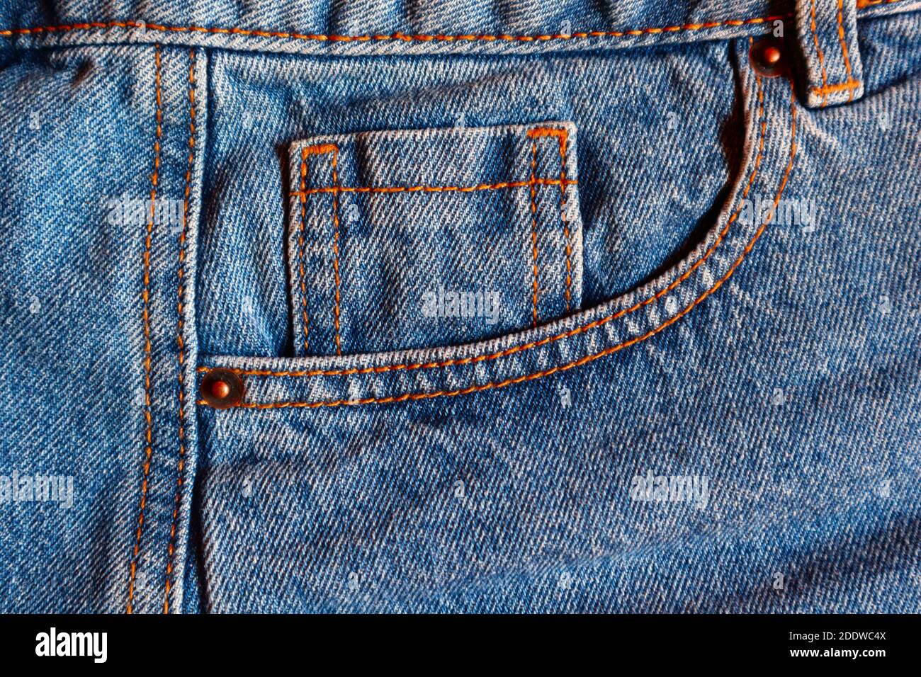 Blue jeans watch pocket close up, denim textile texture for wear ...
