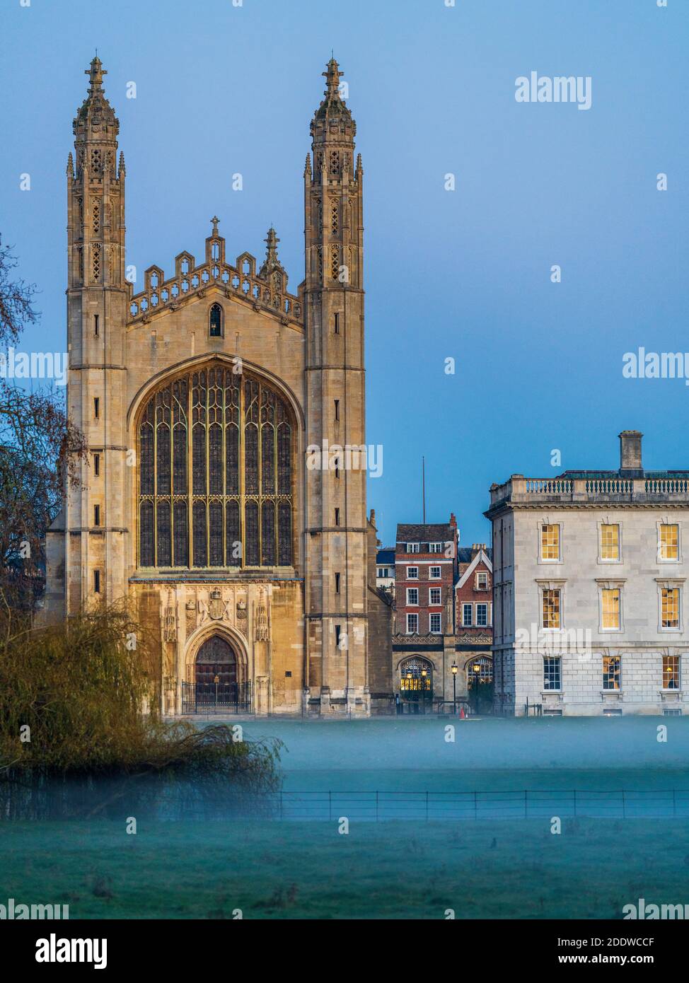 Cambridge Kings College across the Backs at dusk with a gentle mist risen from the River Cam. Stock Photo