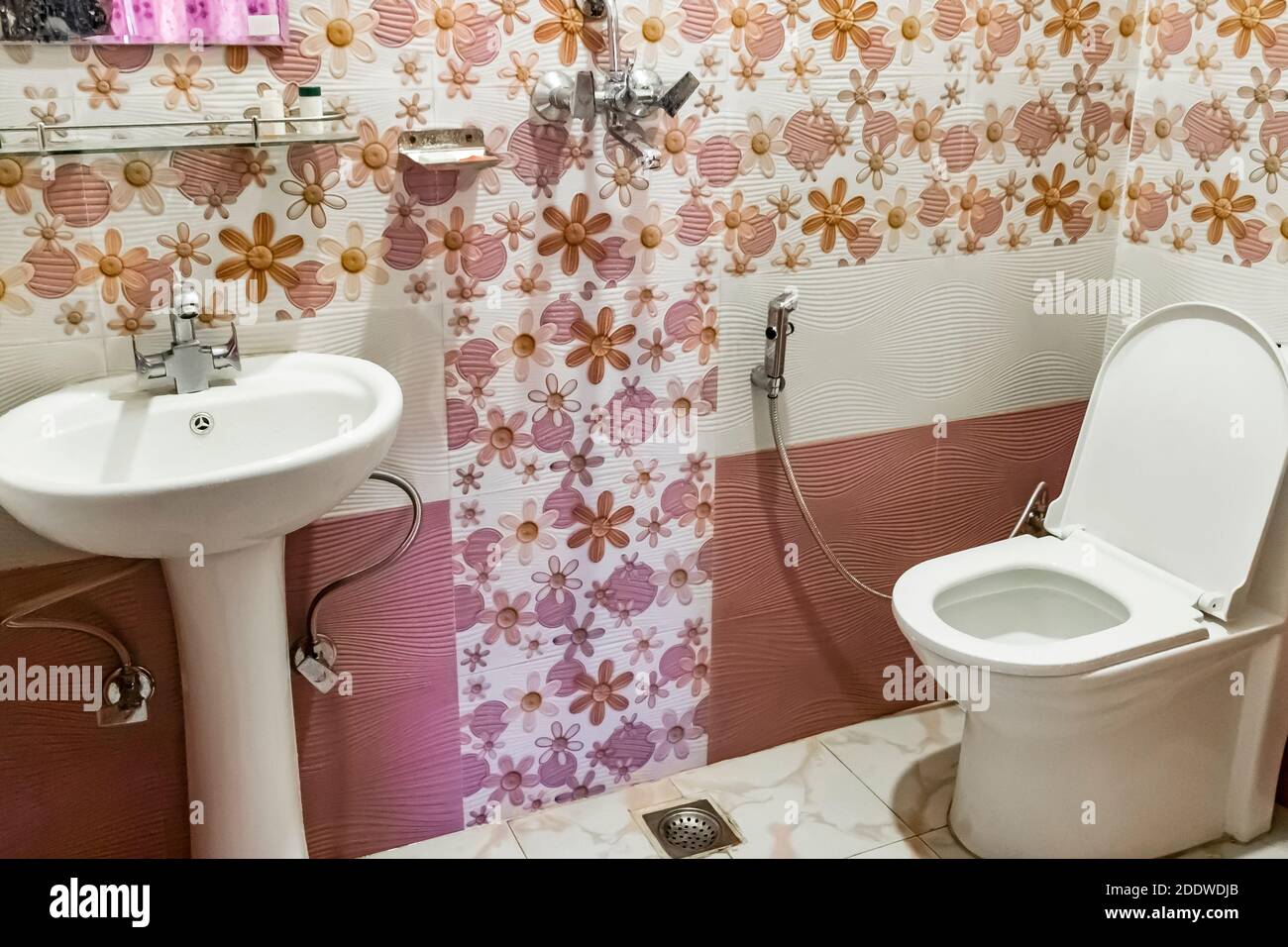Pink toilet bathroom of a hotel room in Sinamangal, Kathmandu, Nepal
