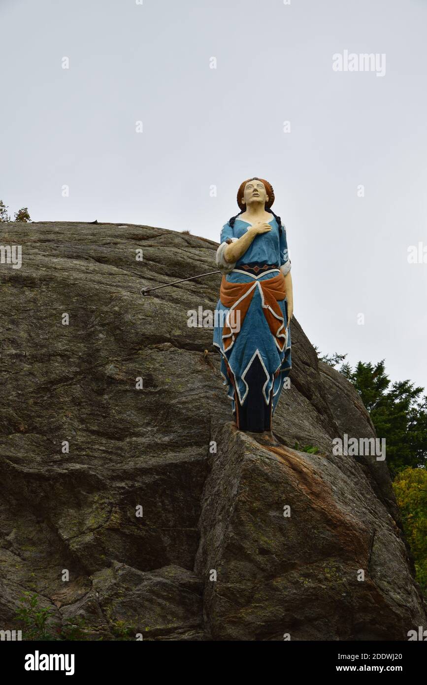The Lady in the Park is a former ship's figurehead, and welcomes visitors to the tranquil park in Skudeneshavn, Norway. Stock Photo