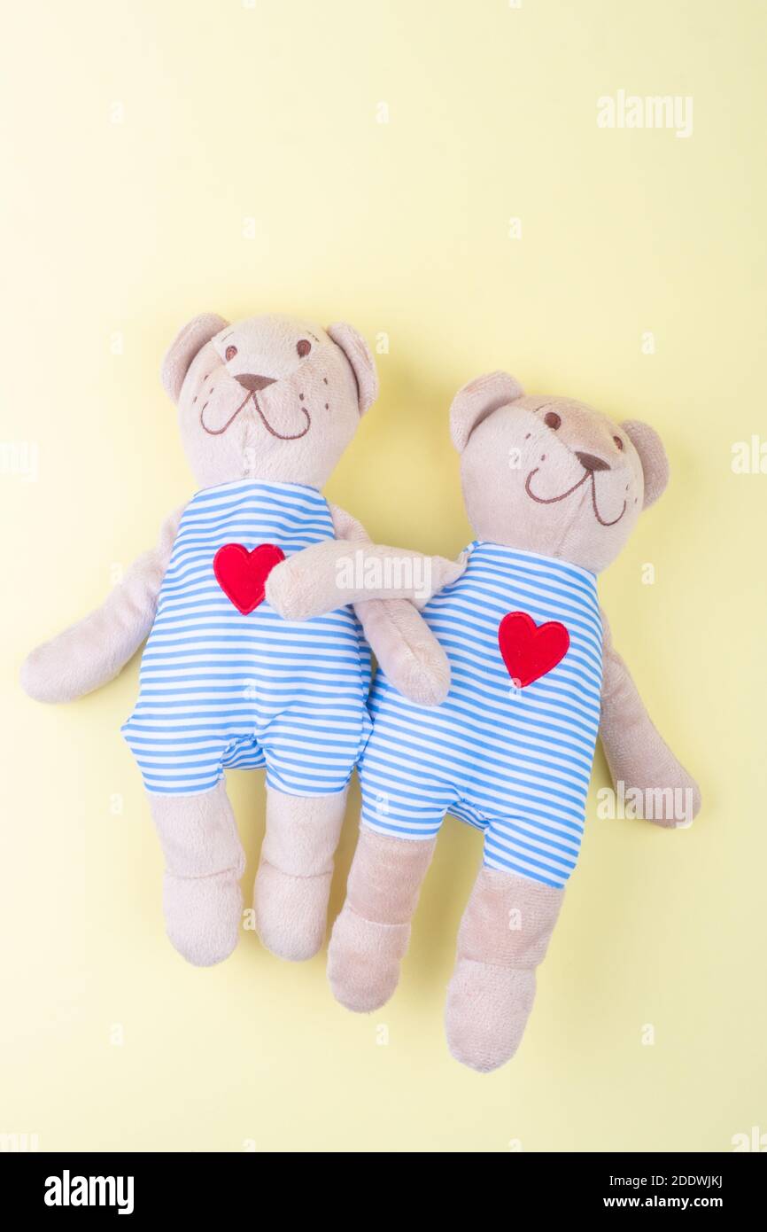 Loving happy two bear couple toy in singlet, with red heart, symbol of love and relationship Valentines Day concept, hugging, romantic style. Creative Stock Photo