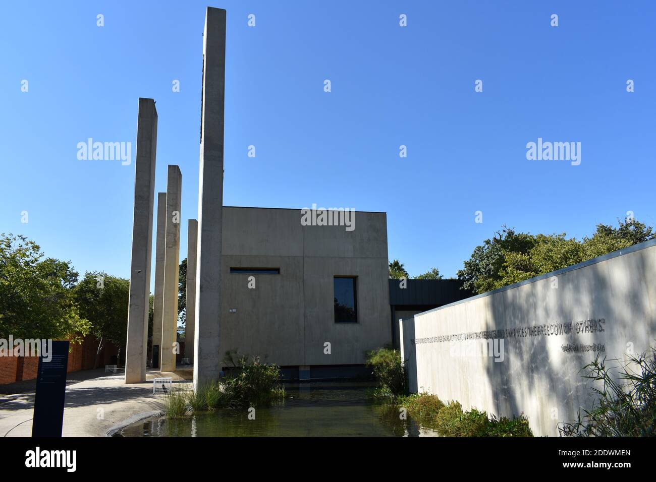 The Pillars of the Constitution, an exhibition in the Apartheid Museum in Johannesburg, South Africa. The white building contrasts with the blue sky. Stock Photo