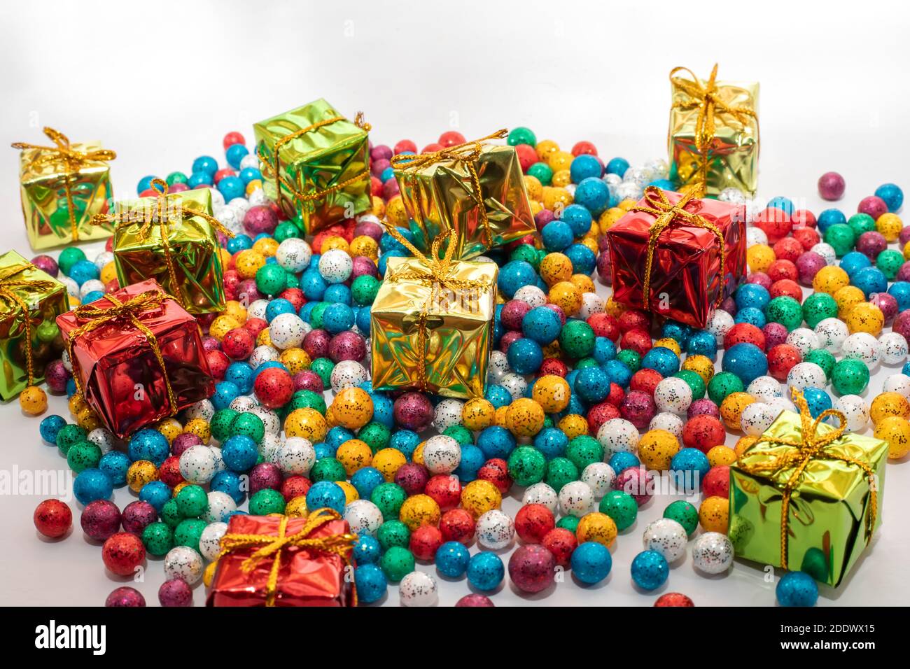 Gift boxes with colorful balls on white backgrounds Stock Photo
