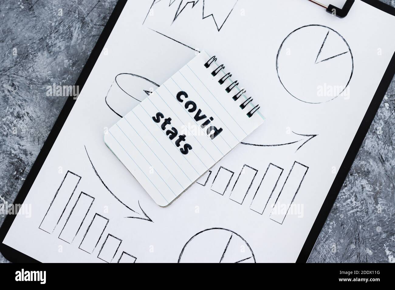 life after the covid-19 virus pandemic conceptual image, clipboard with graph and Covid Stats text Stock Photo