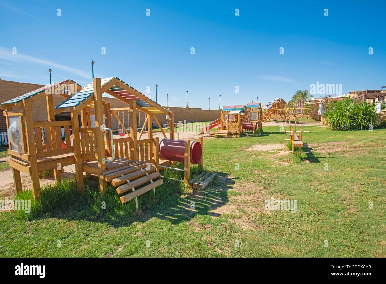 Large wooden climbing frame structure in children's playground area of luxury hotel resort Stock Photo