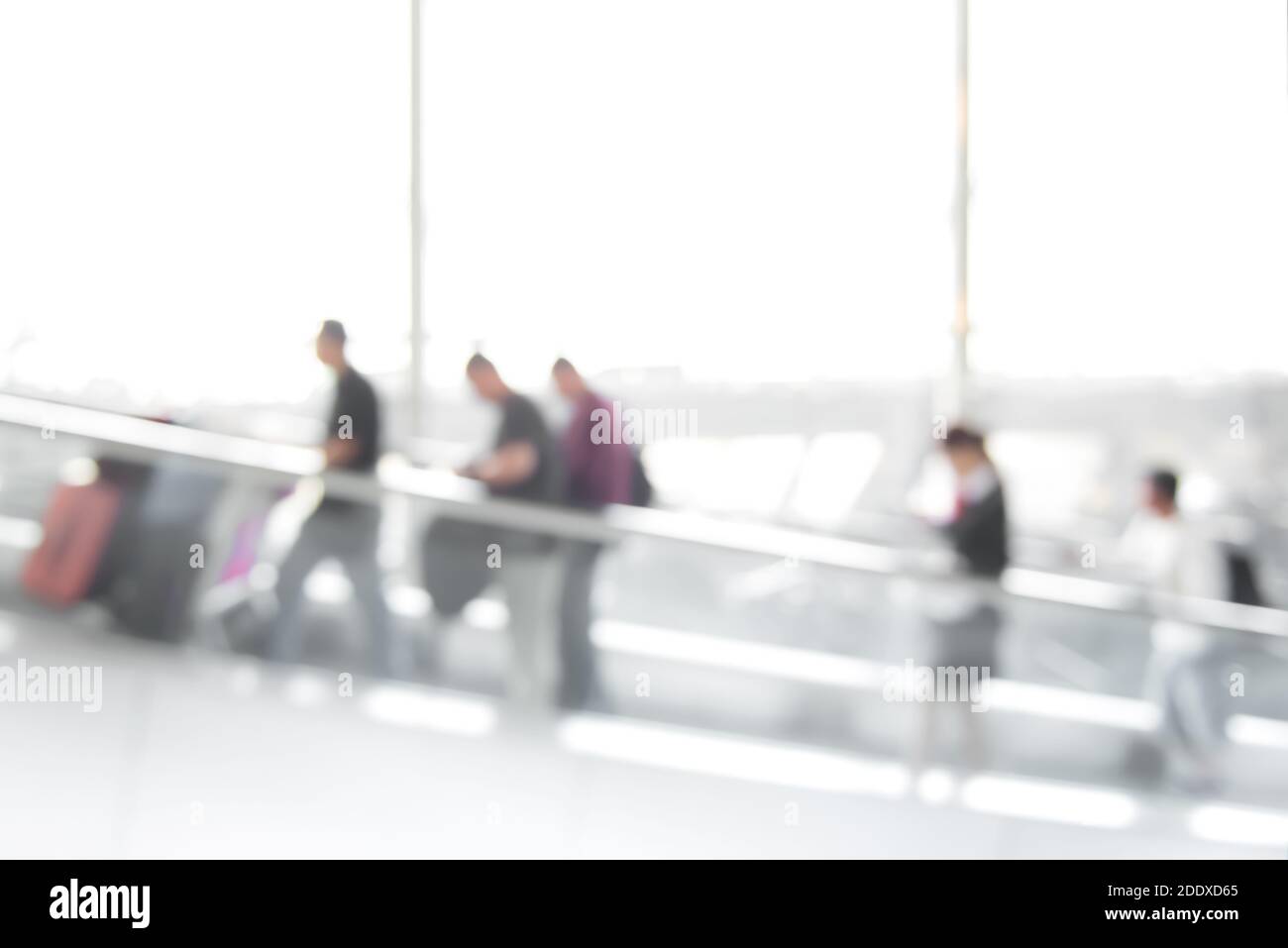 Blur image of people (travelers) on escalator inside airport terminal Stock Photo