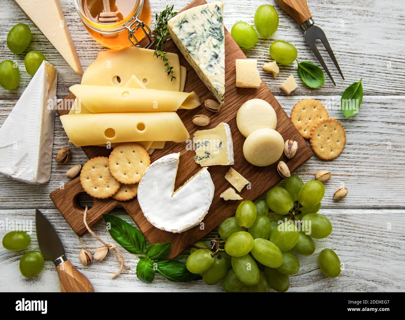 Various types of cheese on a white wooden background Stock Photo - Alamy