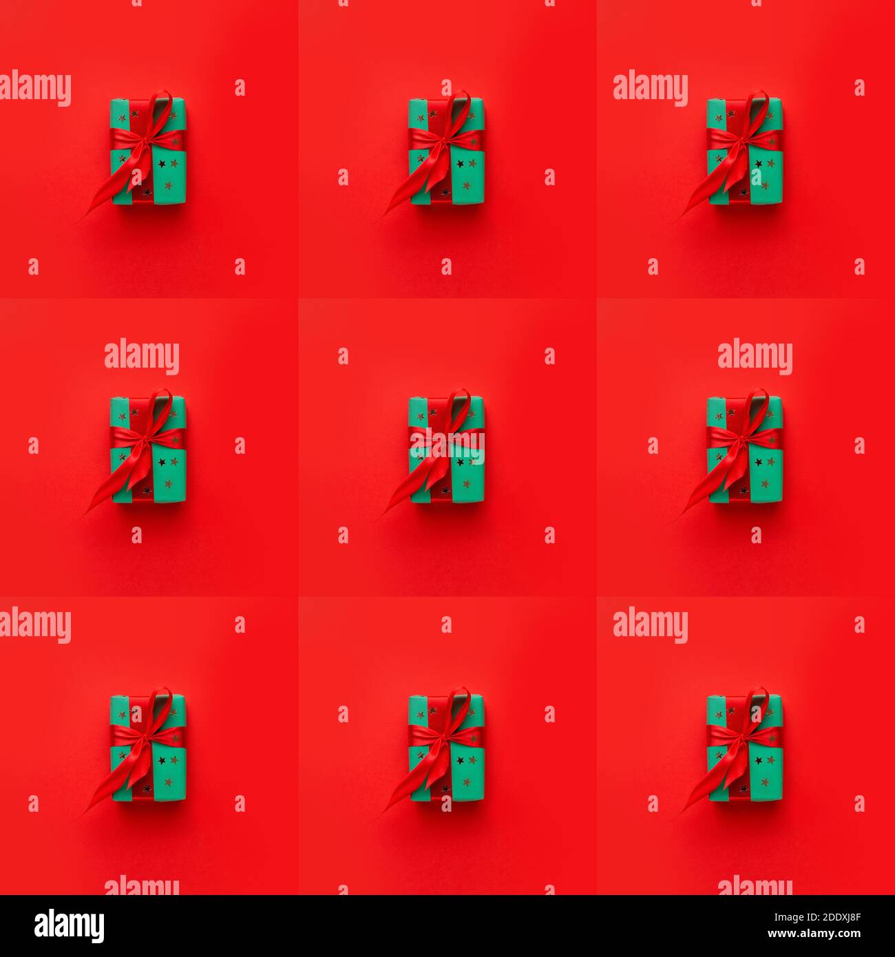 Seamless pattern with Christmas gift box with bow on red background Stock Photo