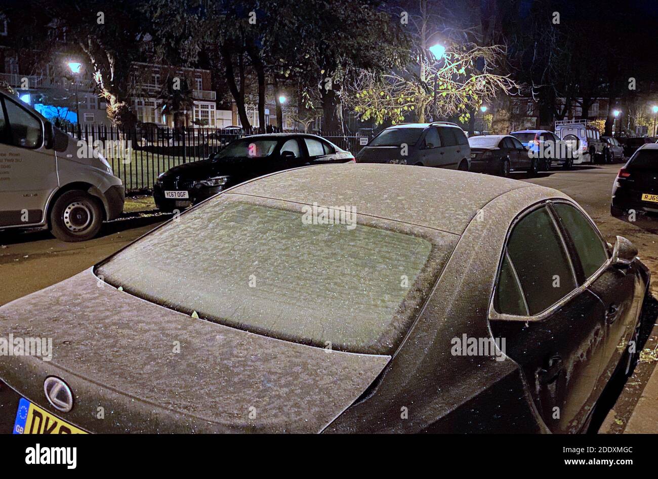 Frost glistens on the roof of a car in Kew Gardens, southwest London, after overnight temperatures in parts of southern England dropped below freezing. Stock Photo