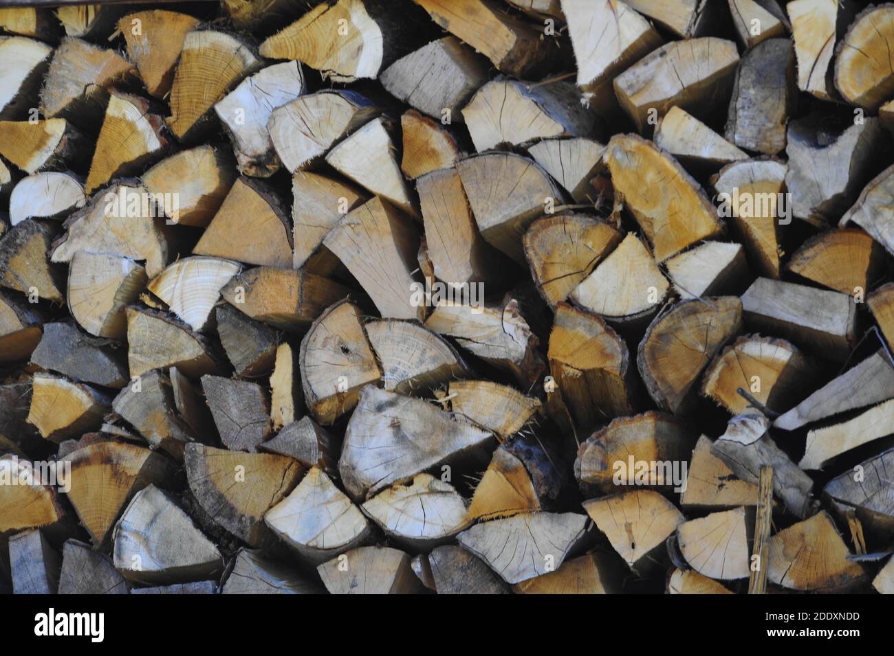 piled up logs or firewood, a renewable energy resource for heating Stock Photo Alamy