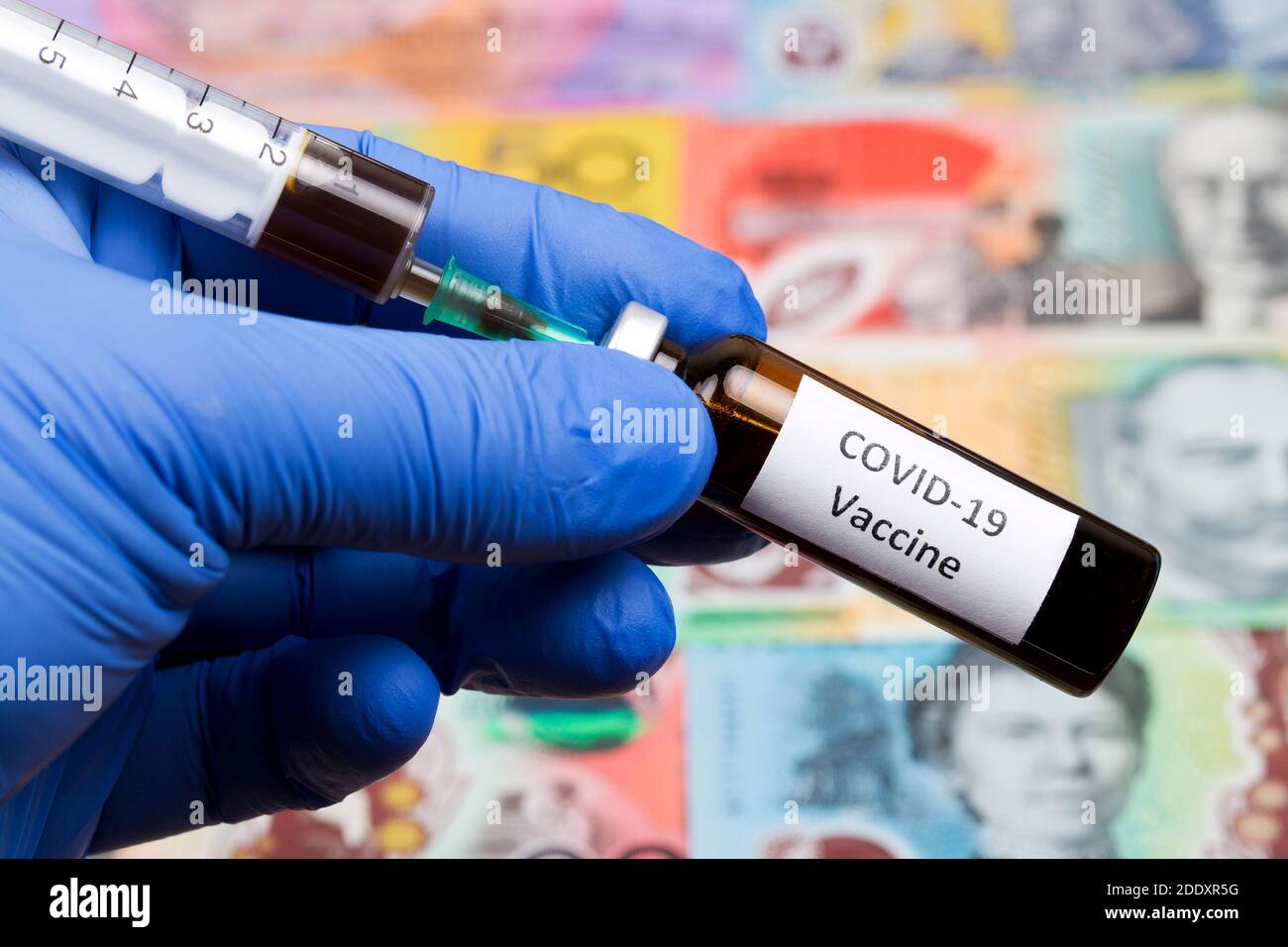 Vaccine against Covid-19 on the background of Australian money Stock Photo