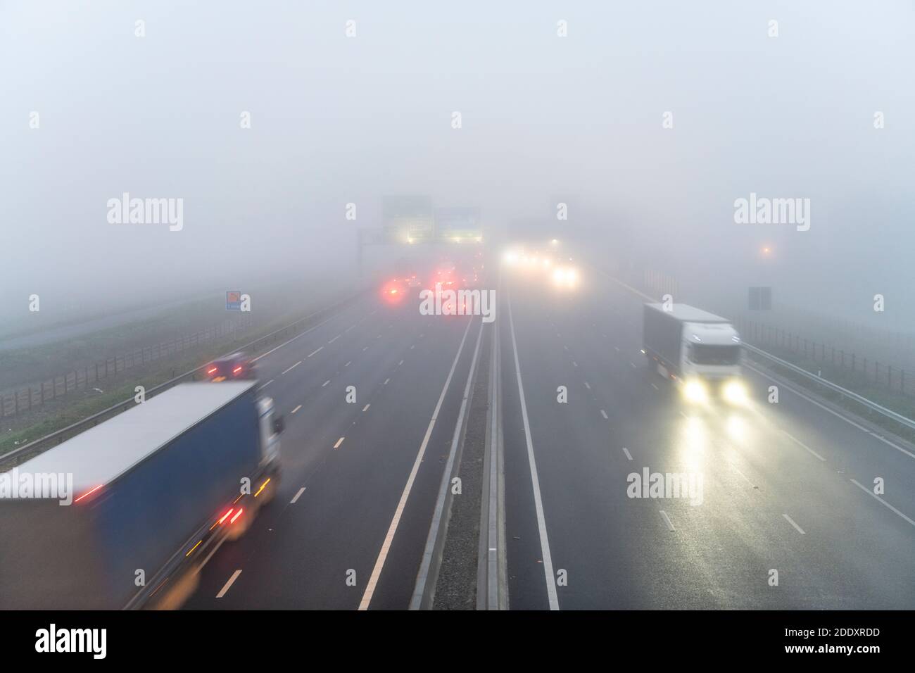 Bar Hill Cambridgeshire, UK. 27th Nov, 2020. Drivers on the A14 dual carriageway road near Cambridge faced freezing fog and poor visibility today. Foggy weather blanketed much of the east of England this morning and is forecast to continue most of the day. Credit: Julian Eales/Alamy Live News Stock Photo