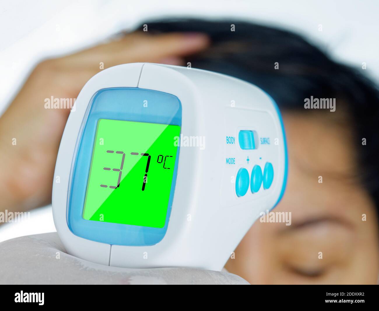 Gun electronic medical thermometer measuring Handheld Forehead Readings  diagnostic display shows the result of the body temperature measurement  36.6 C Stock Photo - Alamy
