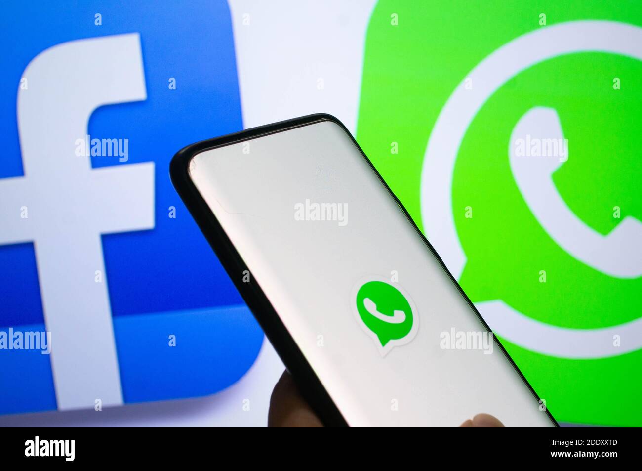 Jaipur, India, Circa 2020 - A mobile logged into the whatsapp mobile application infront of the white light board with facebook and whatsapp logo on i Stock Photo