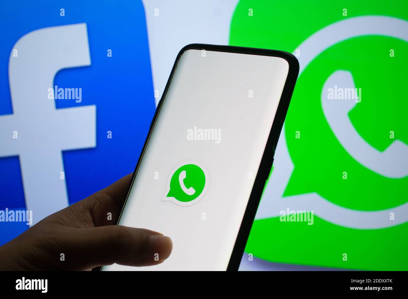 Jaipur, India, Circa 2020 - A mobile logged into the whatsapp mobile application infront of the white light board with facebook and whatsapp logo on i Stock Photo