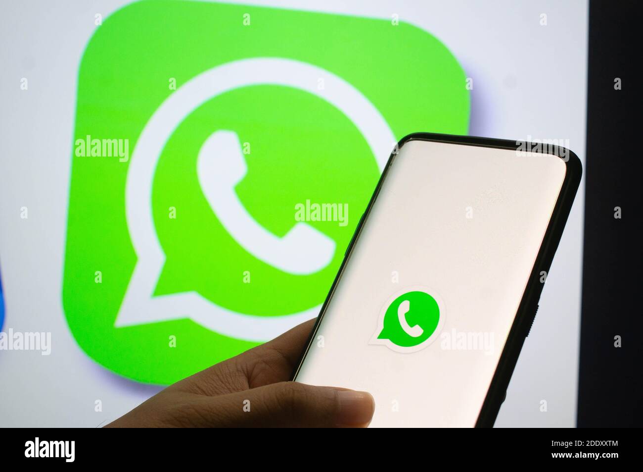 Jaipur, India, Circa 2020 - A mobile logged into the whatsapp mobile application infront of the white light board with whatsapp logo on it. The backgr Stock Photo