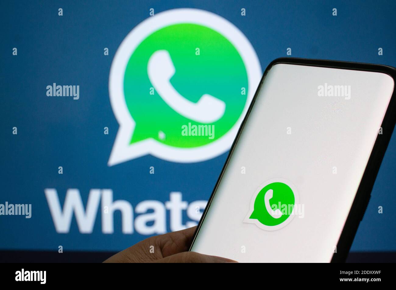 Jaipur, India, Circa 2020 - A mobile logged into the whatsapp mobile application infront of the white light board with whatsapp logo on it. The backgr Stock Photo