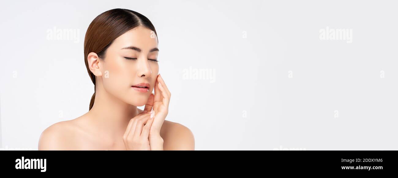 Beautiful young Asian woman with eyes closed looking serene and gently ...