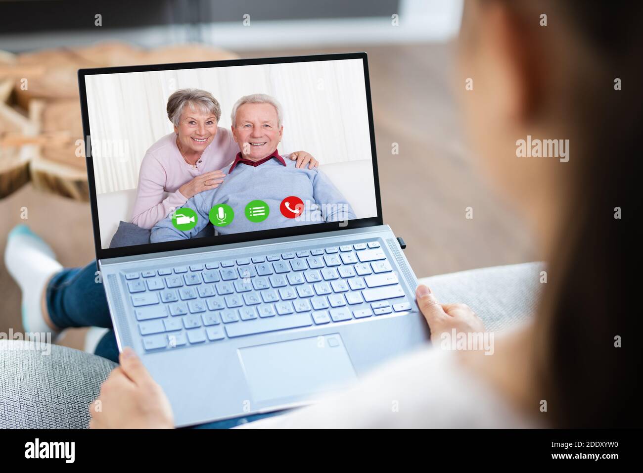 Woman Video Chat On Computer Laptop With Parents Stock Photo