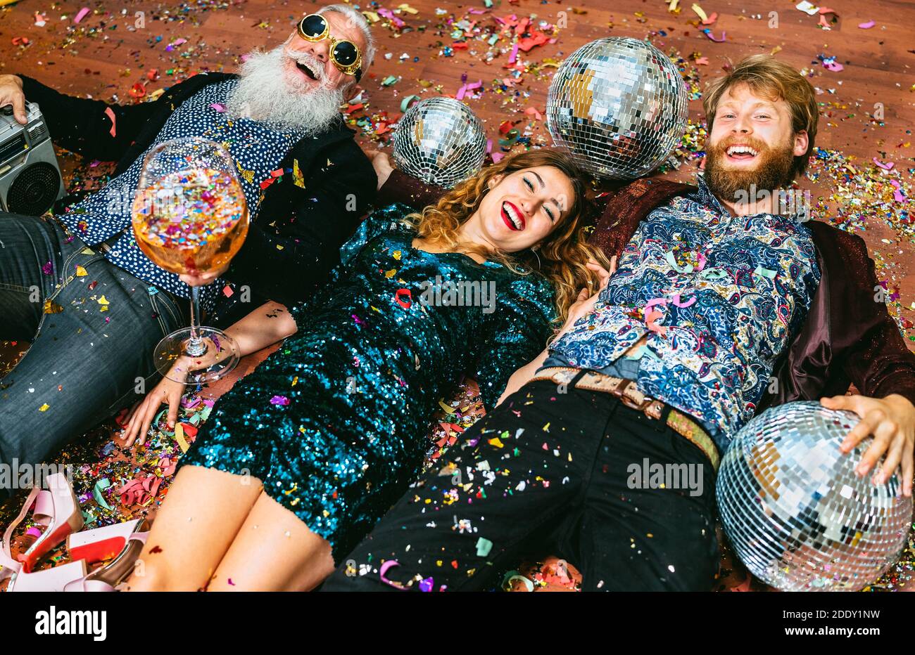 Happy party people with different age having fun celebrating holidays new year's eve Stock Photo