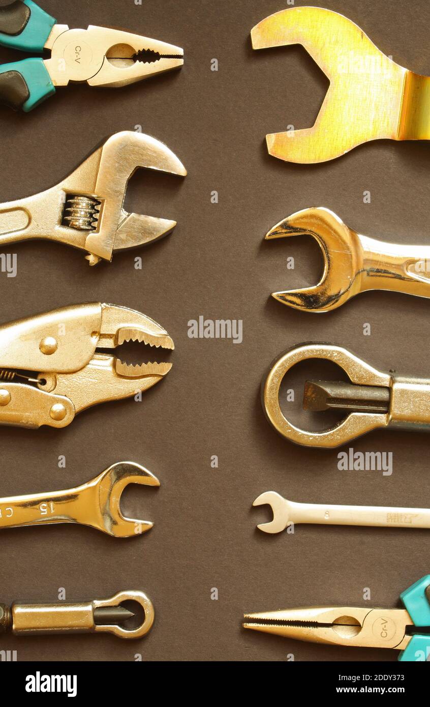 Variety of hand tools, including spanners, nut splitters, grips and pliers Stock Photo