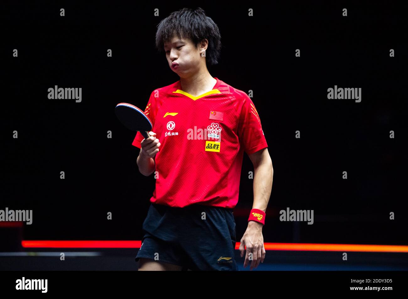 Macao, China. 27th Nov, 2020. Xu Xin of China returns the