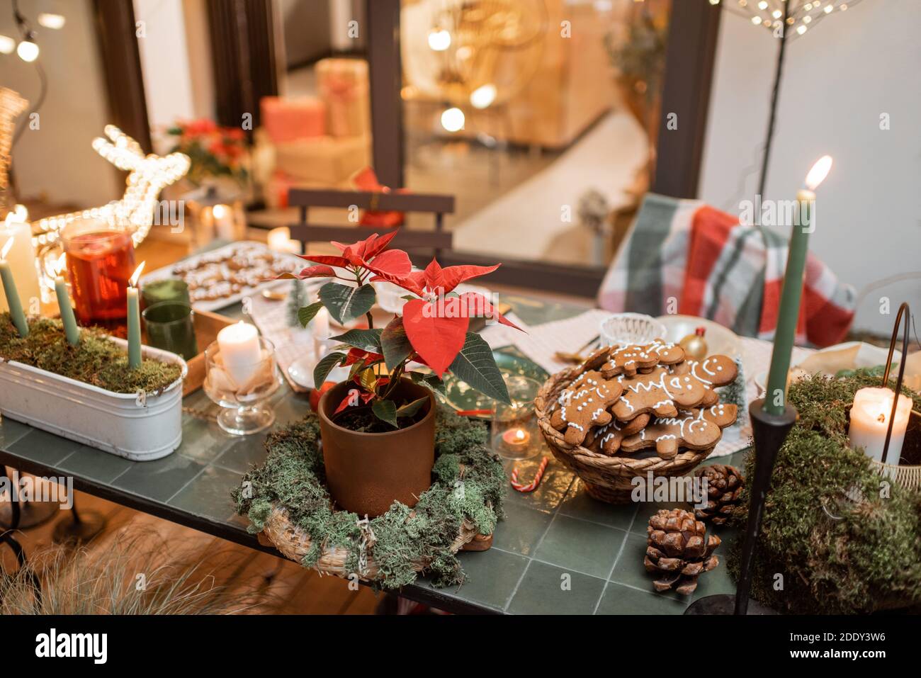 Beautifully decorated dinner table on the terrace outdoors during the New Year holidays Stock Photo
