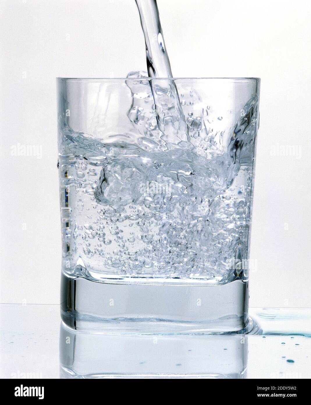 Glass of Sparkling Water against White Background Stock Photo - Alamy