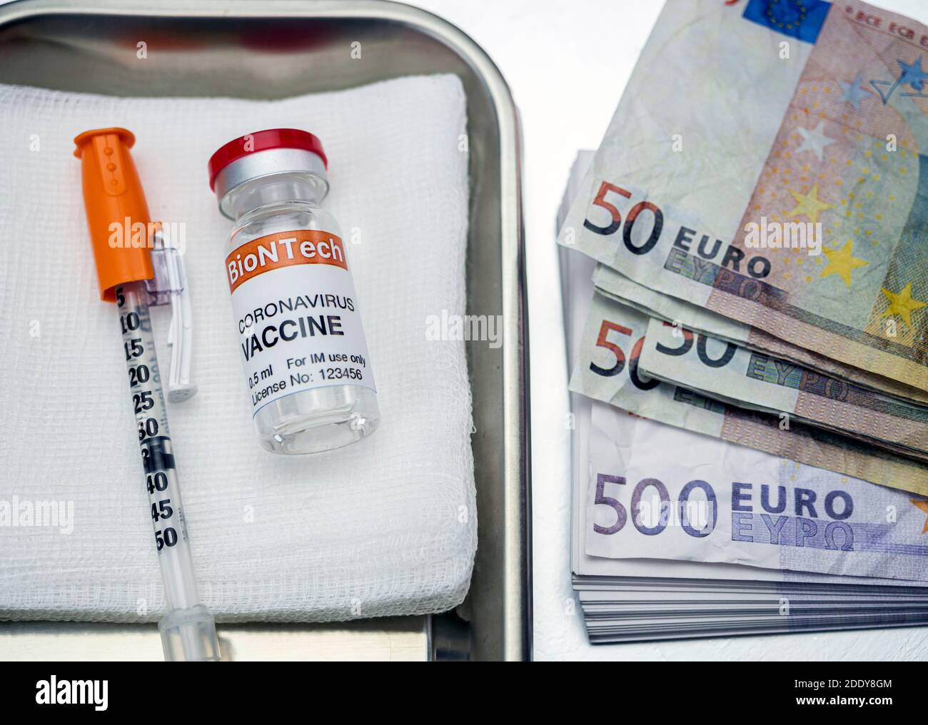 Covid-19 coronavirus vaccine for vaccination plan together with banknotes, conceptual image, recreation experimental treatment fictitious Stock Photo