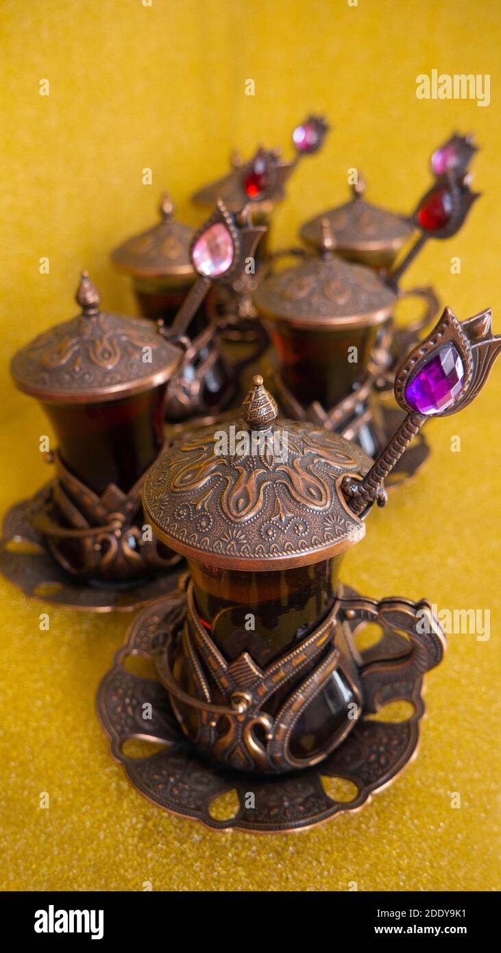 Rosehip tea in traditional Turkish copper tea set and spoons Stock ...
