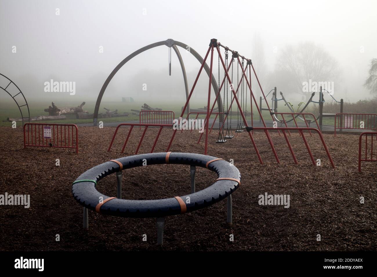 Playground equipment in St. Nicholas Park on a foggy November day, Warwick, Warwickshire, England, UK Stock Photo