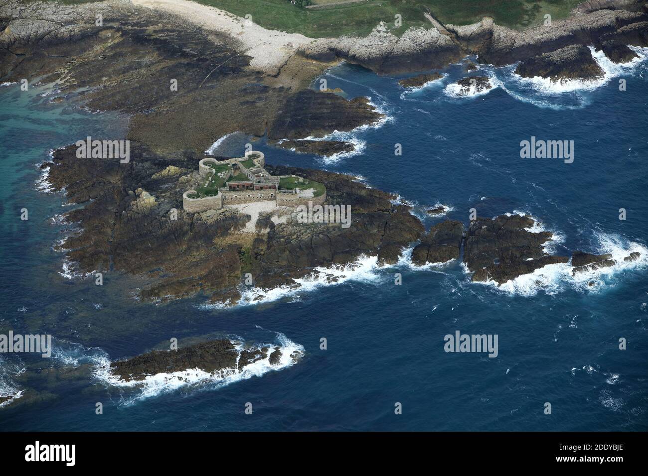 Channel Islands, Alderney: aerial view of the ruins of Fort Houmet Herbe on St Anne's Island. Stock Photo