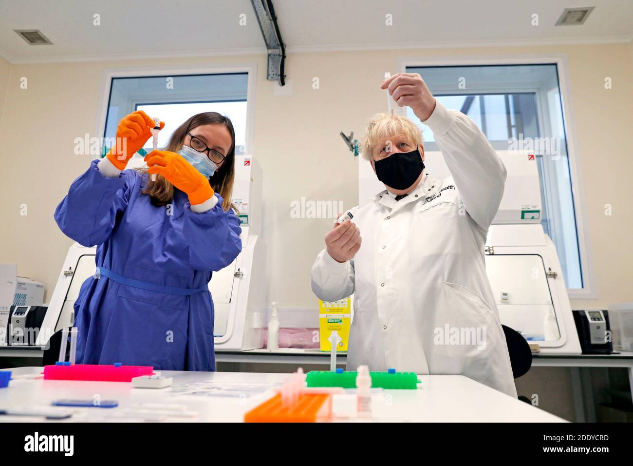 Prime Minister Boris Johnson looks at samples with Doctor Abbie Bown in ...