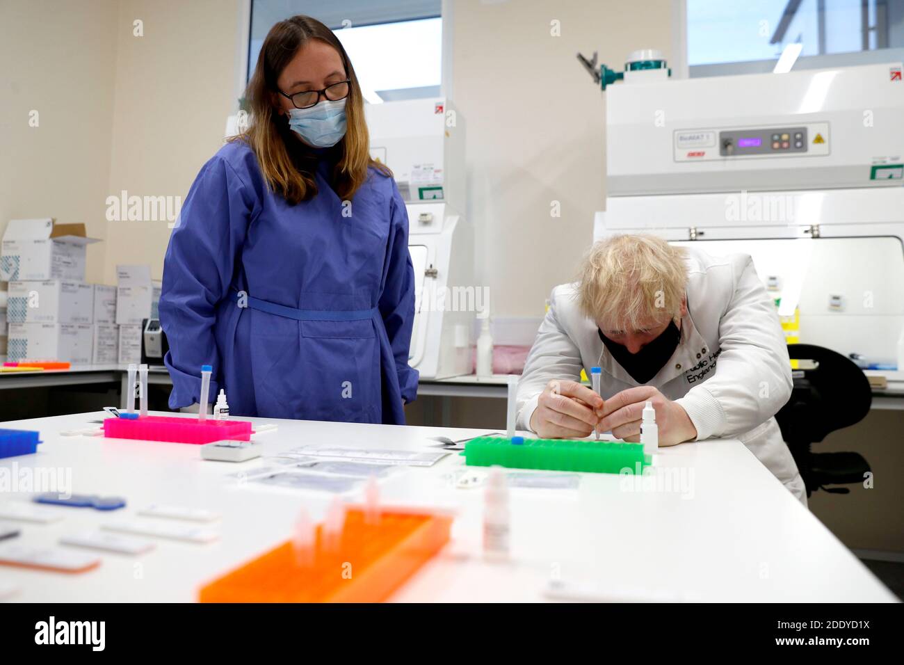 Prime Minister Boris Johnson looks at samples with Doctor Abbie Bown in ...