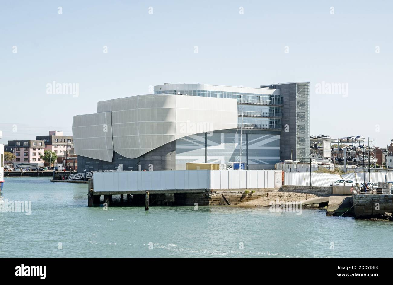 The landmark headquarters of the sailing organisation Ben Ainslie Racing overlooking Portsmouth Harbour on a sunny summer day.  Sir Ben Ainslie is on Stock Photo