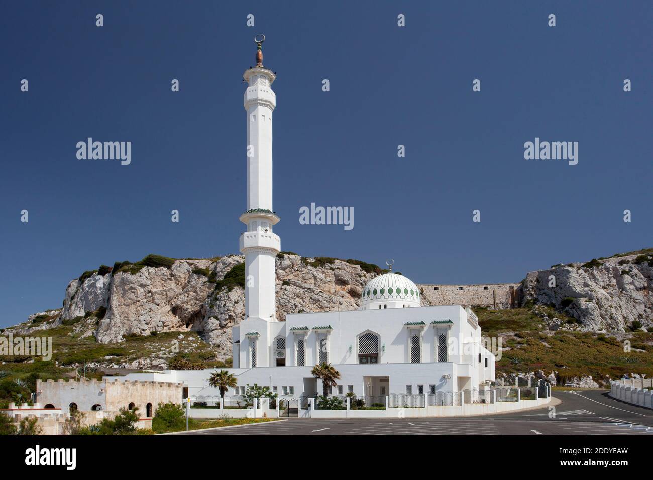 A beautiful mosque on the coast in Gibraltar, set against a rocky hillside Stock Photo